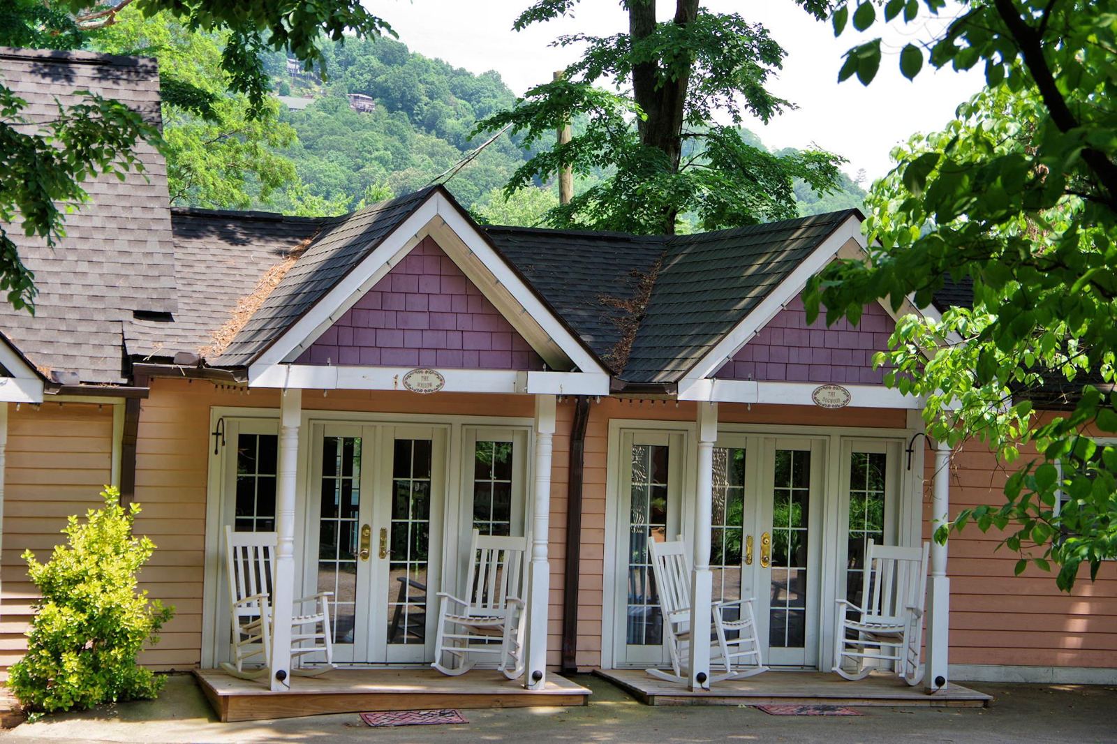 Carriage house cottages with French doors, private porches and rocking chairs