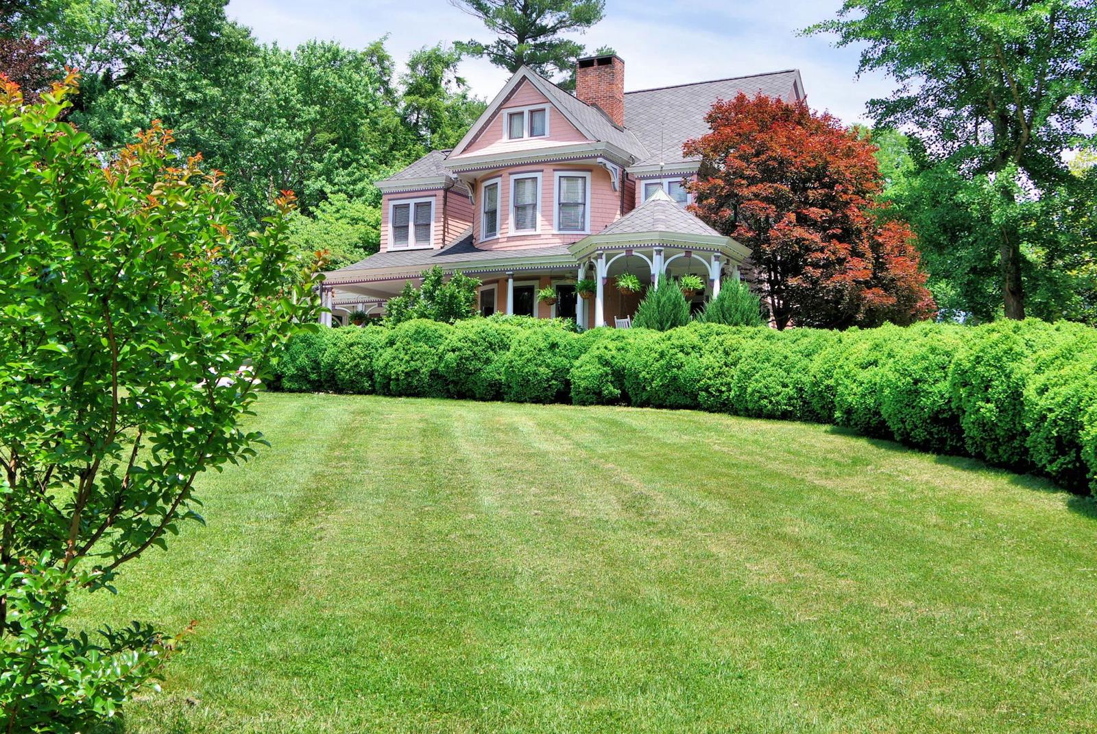 Flower beds and lawns around the inn